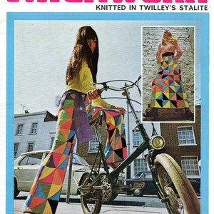 May include: A vintage magazine cover featuring a woman wearing colorful patchwork pants and riding a bicycle. The magazine is titled "Twilley's Patchwork" and the text "Knitted in Twilley's Stalite" is also visible.