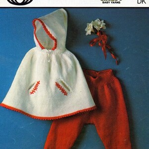 May include: Knitting pattern for a white hooded cape and red pants for a baby. The pattern is from Sirdar Snuggly Baby Yarns and is number 3333. The pattern is for sizes 21-23 inches.