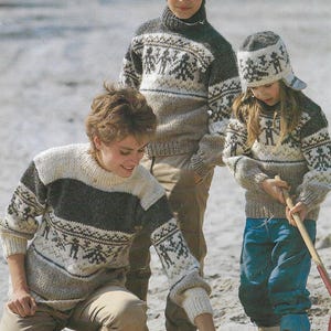 May include: An advertisement featuring three children wearing Icelandic wool sweaters and a hat. The sweaters are in shades of gray, beige, and white, with a patterned design. The text "Alafoss lopi hespu-lopi" is at the top, and "Alafoss of Iceland" is at the bottom.