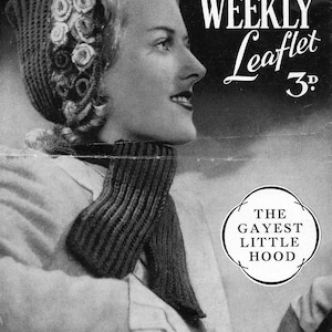 May include: A black and white photograph of a woman wearing a knitted hat and scarf. The hat features a floral design and the scarf is a simple knit. The text "Womans Weekly Leaflet 3d" is printed on the page. The text "The Gayest Little Hood" is printed in a circle.