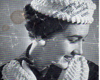 May include: A black and white photo of a woman wearing a white knitted pillbox hat and matching mittens. The hat and mittens have a textured, bobbly design. The text "WELDONS KNITWEAR 4D A1169" is visible in the top left corner of the image. The text "PILLBOX and MITTS Average Size Hat: 3 ozs. Double Knitting. Mitts: 3 ozs." is visible in the top right corner of the image. The text "CLA'S WOOL SHOP LTD., 251, HIGH STREET, BECKENHAM, KENT." is visible in the top right corner of the image.