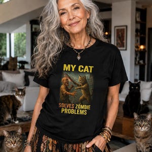 My Cat Solves Zombie Problems T-Shirt | Funny Cat Zombie Tee | Claw & Order Zombie Squad