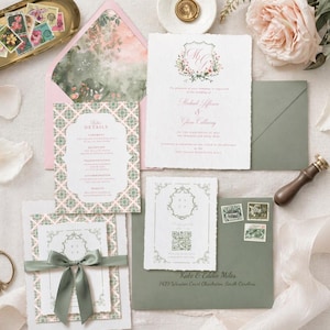 May include: Elegant wedding stationery set featuring invitation cards, RSVP cards, and envelopes. The design includes floral accents, a decorative border, and a soft color palette of pink, green, and white. Includes a gold tray with stamps, scissors, and a wax seal.