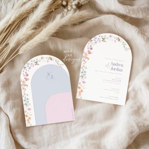 May include: Two arched wedding invitations with floral accents. One features a light blue and pink design with initials, the other includes event details. The text "Mint as Designs" is visible.