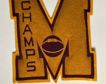 Vintage Raised felt patch-letter “M” with basketball champs