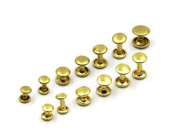 May include: Assortment of gold-toned metal rivets in various sizes. The rivets have a domed head and a post.