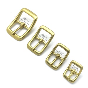May include: Four gold-tone metal belt buckles in different sizes. The buckles measure 25mm, 20mm, 16mm, and 13mm.