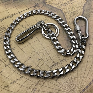 May include: A silver-colored chain with a hook and a carabiner clip. The chain is made of interlocking links and is displayed on a vintage map background. The hook and clip are both shiny and metallic.