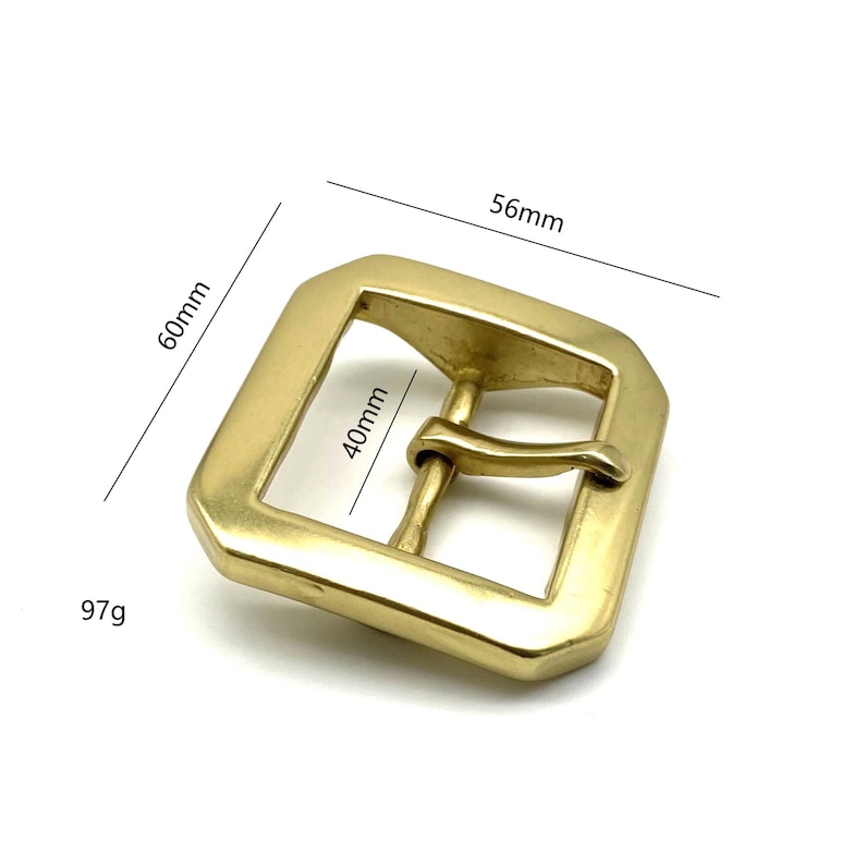 May include: A gold-tone metal belt buckle with a square shape and a 40mm x 56mm size. The buckle weighs 97 grams.