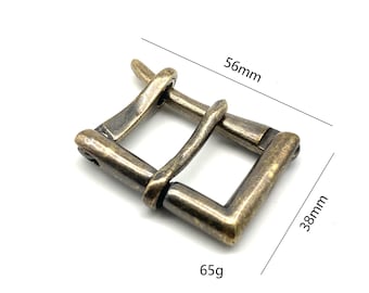 May include: A rectangular, antique brass belt buckle. The buckle measures 56mm long and 38mm wide, and weighs 65g. The buckle has a classic design with a single bar and a prong for securing a belt.