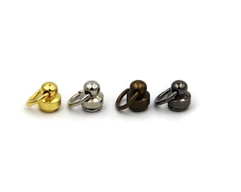 May include: Four metal swivel snap hooks with a round top and a ring. The hooks are in gold, silver, bronze, and black.