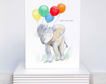 May include: A watercolor birthday card featuring a gray elephant holding colorful balloons. The balloons are yellow, green, blue, red, and orange. The words "HAPPY BIRTHDAY!" are written on the card.