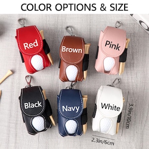 May include: Golf ball holders in red, brown, pink, black, navy, and white. Each holder has a golf ball and tee. The holders are 3.9 inches (10 cm) tall and 2.3 inches (6 cm) wide. The text "COLOR OPTIONS & SIZE" is at the top.