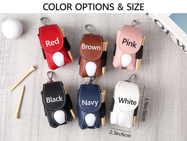 May include: Golf ball holders in red, brown, pink, black, navy, and white. Each holder has a golf ball and tee. The holders are 3.9 inches (10 cm) tall and 2.3 inches (6 cm) wide. The text "COLOR OPTIONS & SIZE" is at the top.