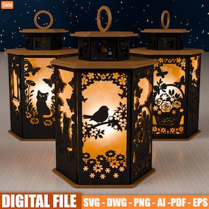 Puede incluir: Tres faroles decorativos negros con intrincados diseños calados. Cada farol tiene una parte superior e inferior de madera, con una luz cálida que emana del interior. Los calados representan mariposas, flores, un gato y un pájaro. El texto "DIGITAL FILE" es visible.