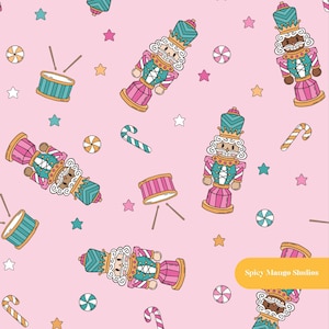 May include: A repeating pattern on a light pink background featuring nutcracker figures in teal and pink uniforms, drums with sticks, striped candy canes, round peppermint sweets, and small stars. The text Spicy Mango Studios appears.