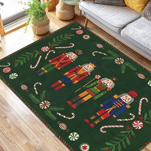 May include: A rectangular green Christmas rug featuring four toy soldier nutcrackers in red, blue, and green uniforms. The rug is decorated with candy canes, peppermint candies, and sprigs of holly.