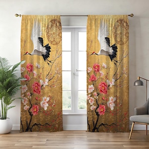 May include: Gold-toned window curtains featuring a crane in flight, cherry blossoms, and a decorative circular design. The curtains have a textured background and are hung on a gold rod. The design includes red, pink, white, and black elements.