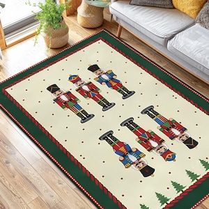 May include: Rectangular area rug featuring a cream-colored background with a pattern of toy nutcracker soldiers in red, blue, and green. The rug has a green border with a red rope design and small Christmas trees.