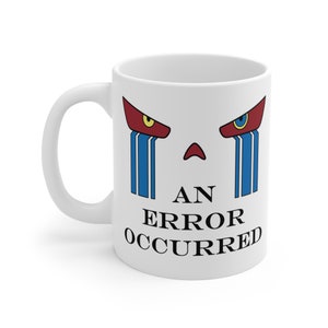 May include: White ceramic mug with a graphic face design in red and blue. The face has red eyebrows, blue tears, and the text "AN ERROR OCCURRED" in black.