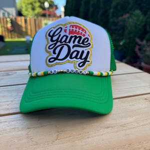 Inspired by the University of Oregon trucker hat with hat chain. Go Ducks Game day hat.