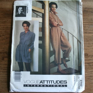 May include: A sewing pattern for a jumpsuit with a V-neck and long sleeves. The pattern is from Vogue Attitudes International and is for sizes 6-10-12. The pattern is shown on two models, one wearing a blue jumpsuit and the other wearing a brown jumpsuit.