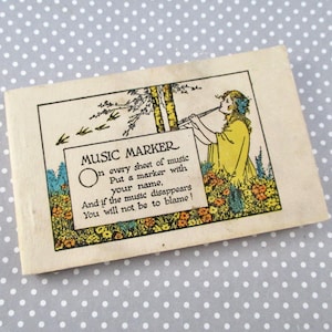 May include: A white ceramic mug with a black handle and the text "But First, Coffee" in a bold, black font. The mug is set against a neutral background, highlighting its simple design.