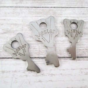 Three Vintage Master Lock Keys