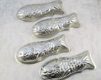 Four Vintage Aluminum Fish Molds