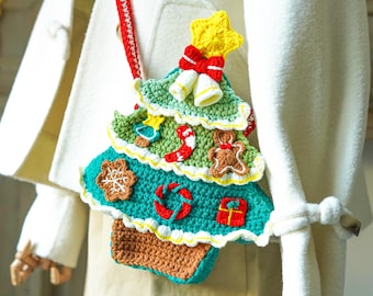 May include: A crocheted Christmas tree-shaped crossbody bag with a red strap. The bag is green, teal, and brown, decorated with a yellow star, red bow, bells, and gingerbread man. The bag is worn over a white coat.