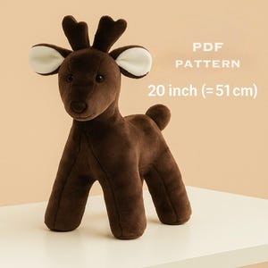 May include: A brown plush deer with antlers and white-lined ears. The stuffed animal is approximately 20 inches (51 cm) tall. The text "PDF PATTERN" is above the size measurement.