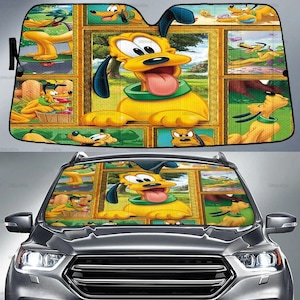 Puede incluir: Un parasol para coche amarillo y negro con Pluto, el perro de dibujos animados de Disney. El parasol tiene una imagen central grande de Pluto con la lengua fuera, rodeada de imágenes más pequeñas de Pluto en varias poses. El parasol está instalado en un coche gris.