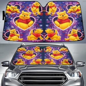 May include: A car windshield sunshade featuring a repeating pattern of Winnie the Pooh characters in various poses. The design includes hearts and a purple and blue background, creating a cheerful and decorative accessory.