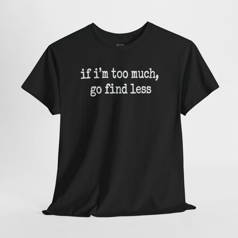A black t-shirt with white text printed on it.