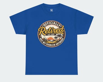 May include: A royal blue short-sleeve t-shirt featuring a circular graphic on the chest. The design includes a sunset, palm trees, and flip-flops with the text "OFFICIALLY RETIRED EST. 2026 NOT MY PROBLEM ANYMORE" in yellow and white lettering.