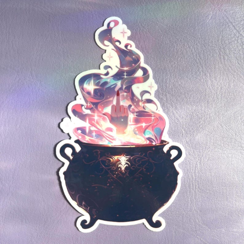 May include: A die-cut sticker featuring a black cauldron with ornate scrollwork patterns. Rising from the cauldron is a swirling, colorful cloud of pink, purple, and blue smoke with small star accents. A hand emerges from the smoke, gesturing.