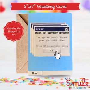 May include: A blue 5" x 7" greeting card with a computer error message that reads "ERROR 404: BIRTHDAY DETECTED". The card includes a brown envelope and the text "Send a Smile Greeting Cards".