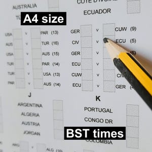 May include: A test form with the text "A4 size" and "BST times" is partially filled in. A pencil with a yellow and black design is positioned over the form. The form contains country names and numerical data, likely for an exam or assessment.