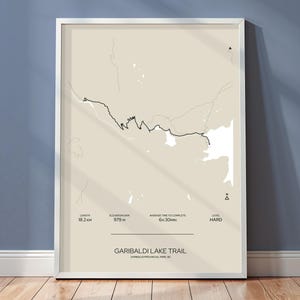 May include: A black and white illustration of the Garibaldi Lake Trail in Garibaldi Provincial Park, BC. The trail is 18.2 km long with an elevation gain of 979 m. The average time to complete the trail is 6 hours and 30 minutes. The trail is considered hard.