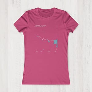 May include: A pink women's t-shirt with a white graphic of a map of Gabriel Lake, Minnesota. The text "Gabriel Lake" is printed above the map.