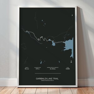 May include: A black and white map of the Garibaldi Lake Trail in Garibaldi Provincial Park, BC. The map shows the trail's length, elevation gain, average time to complete, and difficulty level. The trail is 18.2 miles long, has an elevation gain of 3,212 feet, takes an average of 6 hours and 30 minutes to complete, and is considered hard.