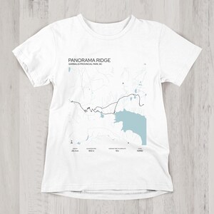 May include: White t-shirt with a black and white map of Panorama Ridge in Garibaldi Provincial Park, BC. The text "Panorama Ridge" and "Garibaldi Provincial Park, BC" is printed on the shirt.