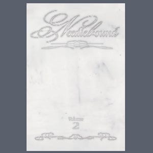 Op de afbeelding: Een witte rechthoekige kaart met het woord "Needlebound" in een elegant lettertype bovenaan. Onder de tekst staat een decoratieve lijn. Het woord "Volume 2" staat gecentreerd onderaan, met een andere decoratieve lijn eronder.