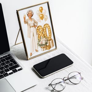 May include: A framed print featuring an illustration of a smiling person with silver hair wearing a cream-colored outfit and holding a champagne glass. Next to them are gold balloons, a large illuminated number 80, and gift boxes with flowers.