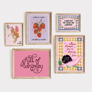 May include: A collection of five framed wall art prints featuring whimsical illustrations and text. The prints include a fairy deer, strawberries with the text 'patience makes everything sweeter', a snail with 'slow down you're doing fine', and text-based art.
