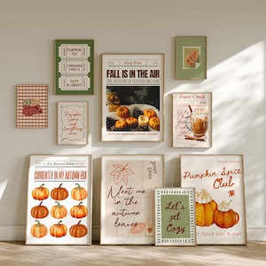 May include: A selection of framed art prints with an autumnal theme. The prints feature pumpkins, fall leaves, and text such as "Fall is in the Air" and "Pumpkin Spice Club." Colours include orange, green, and beige.
