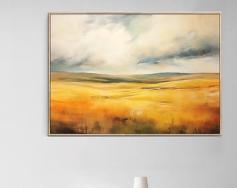 May include: A rectangular landscape painting in a light wood frame featuring a vast field of golden yellow and orange grasses under a dramatic sky filled with swirling white, gray, and dark blue clouds above a distant horizon line.
