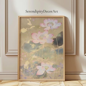 May include: A framed print of a watercolor painting featuring three pink and white lotus flowers with green leaves on a gold background. The painting is titled "SerendipityDecorArt".