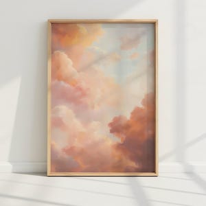 May include: A framed print of a painting depicting a sky with soft, pastel pink and orange clouds. The clouds are layered and create a sense of depth and movement.