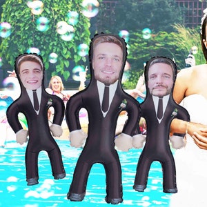 May include: Three inflatable groom dolls in black suits with white shirts and ties. The dolls are floating in a swimming pool.
